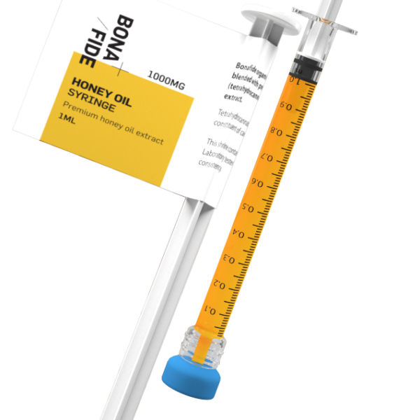 A close-up of a single Bonafide Honey Oil syringe, showcasing the amber-colored oil and precise measurement markings.