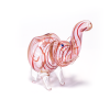 A glass pipe shaped like an elephant, featuring a pink body with red swirling lines and a lifted trunk, made from clear glass.