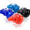 A trio of animal-shaped glass pipes, resembling rhinos, in bright colors: blue, red, and black.