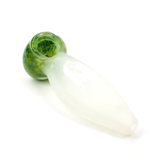 A frosted glass pipe shown at an angle, showcasing its sleek white body and green bowl with speckled detailing for smoking herbs.