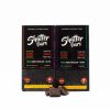 Two Shatter Bars 1200mg THC packages in Vegan Dark Chocolate flavor, available in Sativa and Indica varieties, with dark chocolate squares displayed in front of the packages.