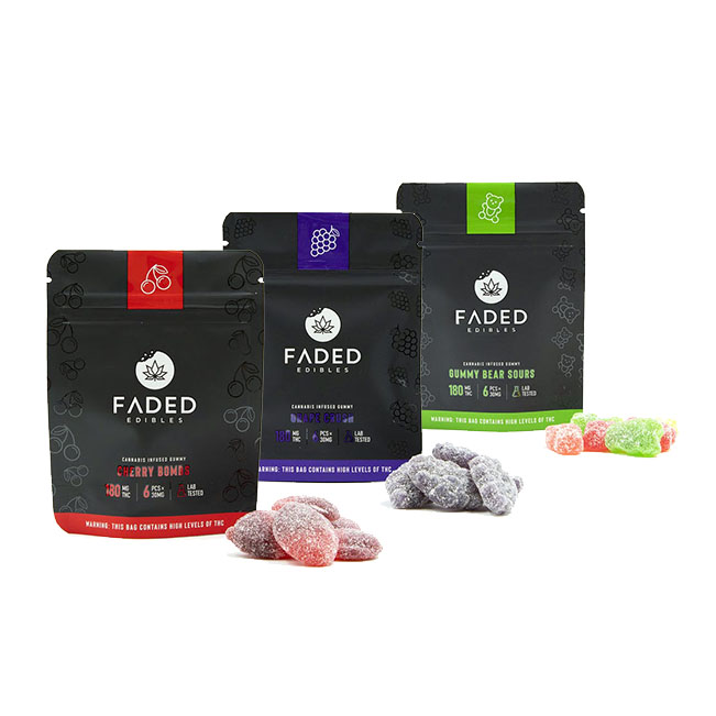 Three Faded Edibles packages: Cherry Bombs (180mg THC), Grape Crush (180mg THC), and Gummy Bear Sours (180mg THC), with gummies in front of each pack, featuring red, purple, and green candies.
