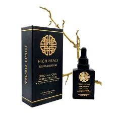 High Heals Relief and Restore CBG Oil packaging and tincture bottle displayed against a natural branch background. The black box and bottle feature gold accents and display '500 mg CBG Herbal Tincture' along with 'Relief & Restore' text