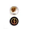 Overhead view of an open jar of High Voltage Extracts Live Resin with a black lid displaying a yellow lightning bolt logo. The live resin is visible inside the glass jar