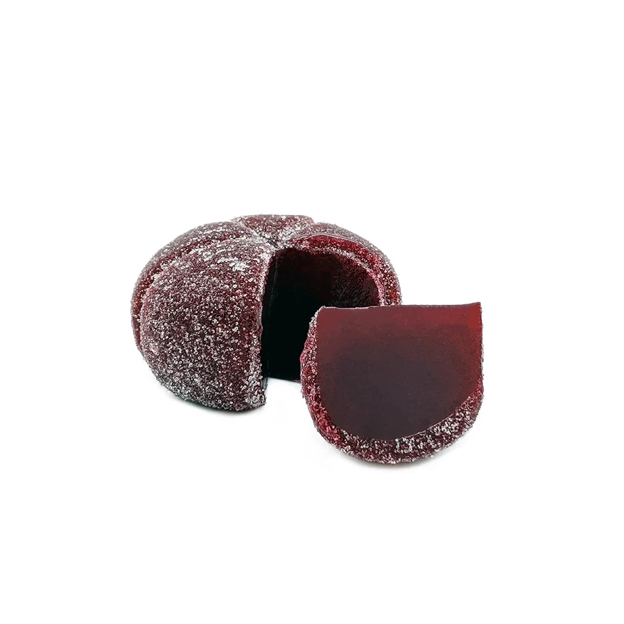 The Mota Black THC Clear Sphere gummy with a piece cut out, showing the rich dark interior of the black cherry-flavored jelly