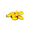 A close-up shot of translucent golden capsules arranged in a pile, showcasing their soft-gel texture