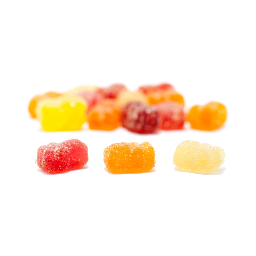 Close-up of assorted colorful gummy bears from MOTA CBD Vegan Gummies, showing red, orange, yellow, and green bears covered in sugar