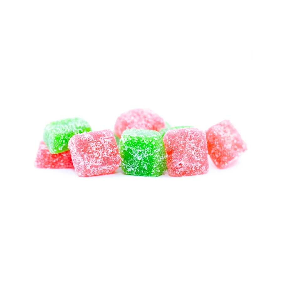 Close-up shot of strawberry and key lime-flavored CBD gummies covered in sugar, arranged in a small pile, showcasing the red and green jelly squares
