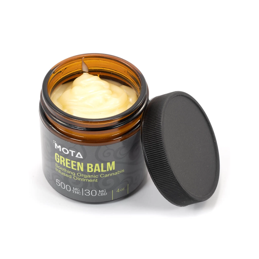 Open jar of MOTA Green Balm, displaying the creamy yellow balm inside, highlighting its 500mg THC and 30mg CBD formulation for muscle pain relief, arthritis, and skin hydration.