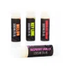 Focused on the Raspberry Vanilla flavor MOTA Lip Balm in the foreground, with three other flavors, Melon, Key Lime, and Chocolate Cherry, blurred in the background, highlighting the THC and CBD content.