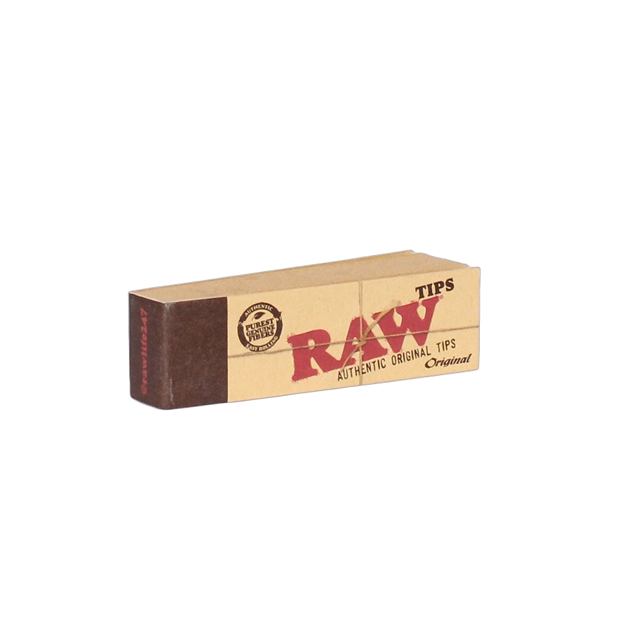 A small rectangular pack of RAW tips Authentic Original Pre-Rolled Tips. The packaging is brown with the RAW logo printed in bold red letters across the front. The words "Authentic Original Tips" and "Purist Natural Fibers" are visible on the package, highlighting RAW's commitment to natural materials. This pack contains 21 pre-rolled tips, designed to offer an easy and convenient rolling experience.