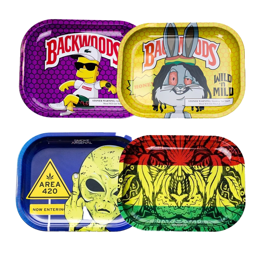 A set of four colorful Smoke Arsenal small weed rolling trays. The top left tray features a parody of a character wearing sunglasses with the "Backwoods" logo in a vibrant purple design. The top right tray showcases a cartoonish Bugs Bunny with dreadlocks and the "Backwoods" logo on a yellow honeycomb pattern background. The bottom left tray has an "Area 420" alien theme, where the alien is flipping the peace sign, set against a blue background. The bottom right tray features a Rastafarian lion design with red, yellow, and green colors. Each tray is compact with rounded edges and deep walls for easy use.
