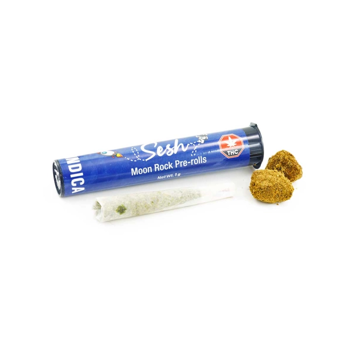 A 1g Sesh Indica Moon Rock Pre Roll, packaged in a blue tube with the joint displayed next to two kief-covered moon rocks, showcasing the premium indica flower infused with distillate and coated in kief for a relaxing smoking experience.