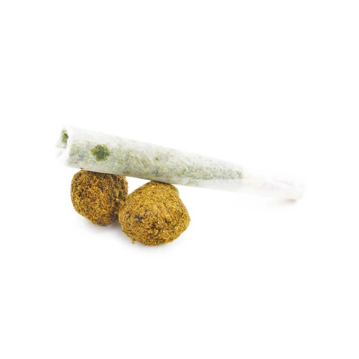 Sesh Moonrock Pre-Roll resting beside two moon rocks, showcasing the kief coating