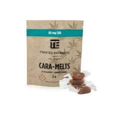 Twisted Extracts CBD Caramelts packaging, displaying 80mg CBD per pack with 8 caramel pieces inside. The brown kraft paper bag is labeled with a green banner highlighting the CBD content