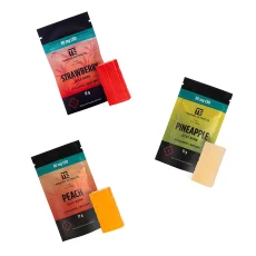 Image showing three packs of Twisted Extracts Jelly Bombs, featuring Strawberry, Pineapple, and Peach flavors. Each pack contains 80mg CBD with 8 pieces per gummy, 10mg CBD per piece