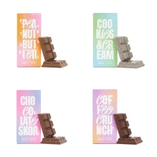 A collection of Euphoria Psychedelics THC Chocolate Bars, including Peanut Butter, Cookies and Cream, Chocolate Skor, and Coffee Crunch, displayed with pastel-colored packaging and chocolate pieces leaning against each box.
