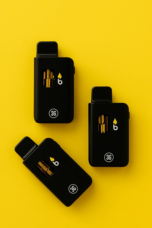 Burn 3G black vape devices with golden cannabis oil on yellow background