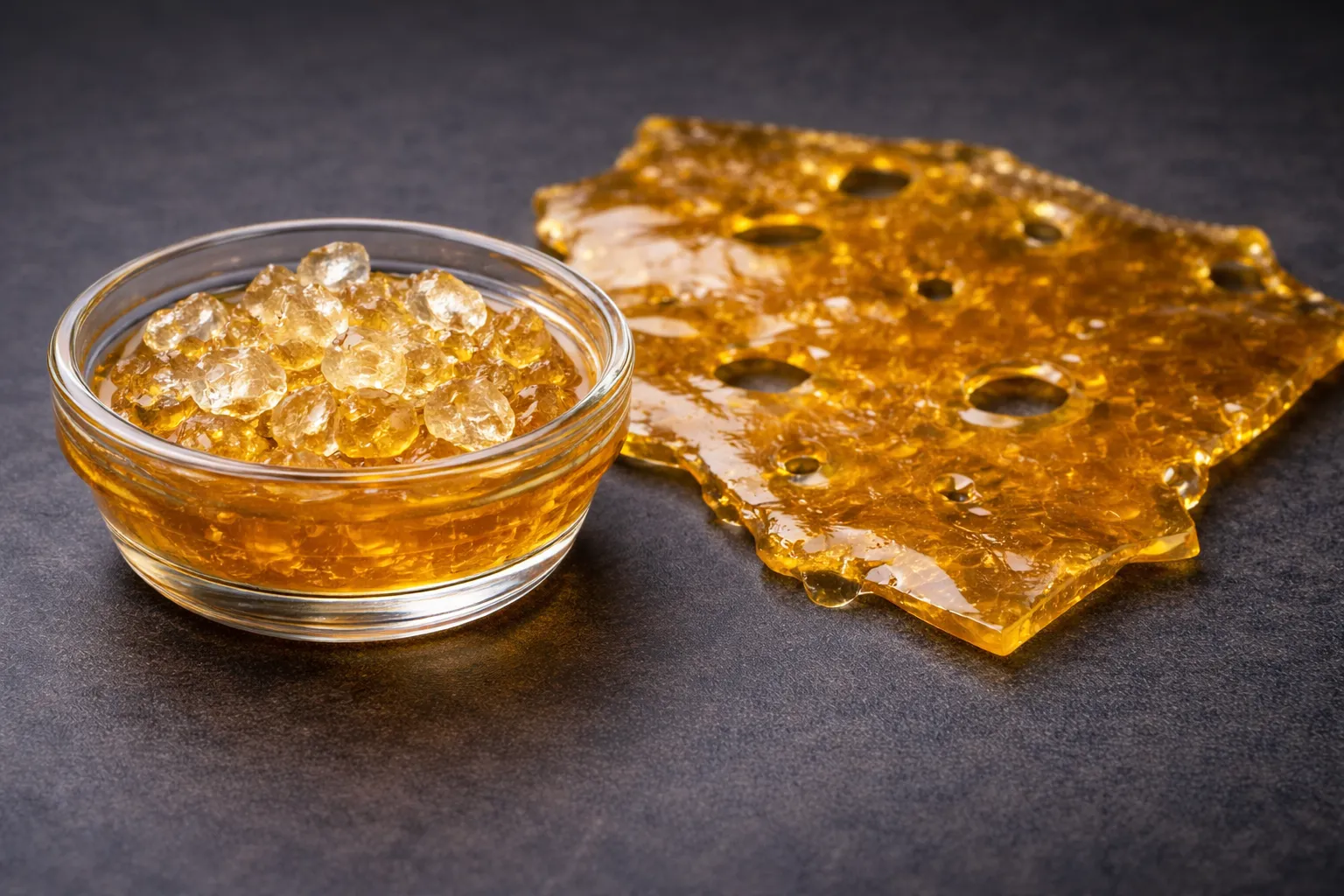 THC diamonds in terpene sauce next to flat shatter slab, shatter vs other cannabis concentrates