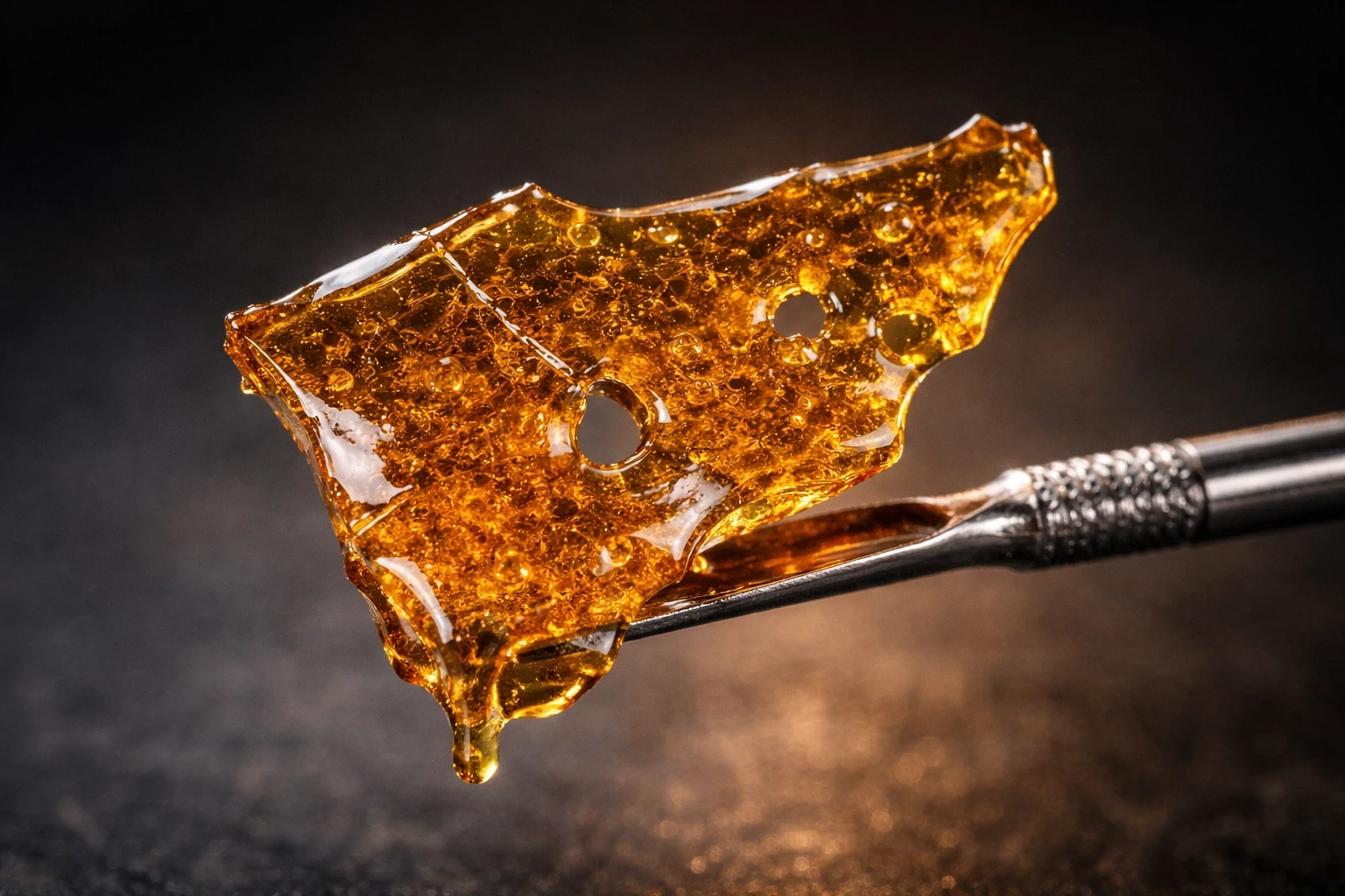 Best Cannabis Concentrates shatter on dab tool close up — Weed Market