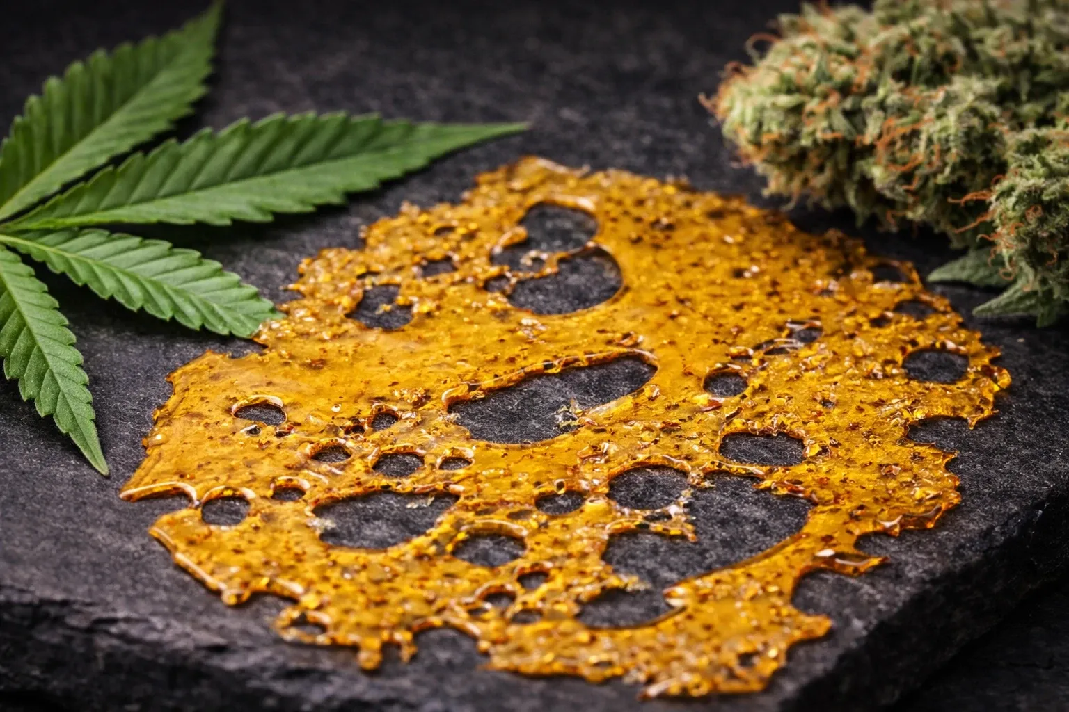 Best Cannabis Concentrates shatter slab on stone with cannabis bud — Weed Market