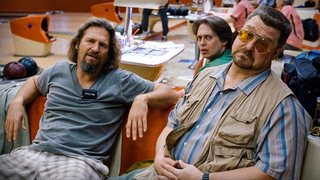 The Dude, Donny and Walter sit together at a bowling alley in The Big Lebowski